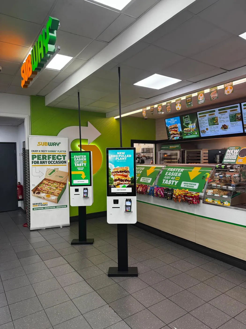 Self-order kiosks at a Valli food-to-go counter